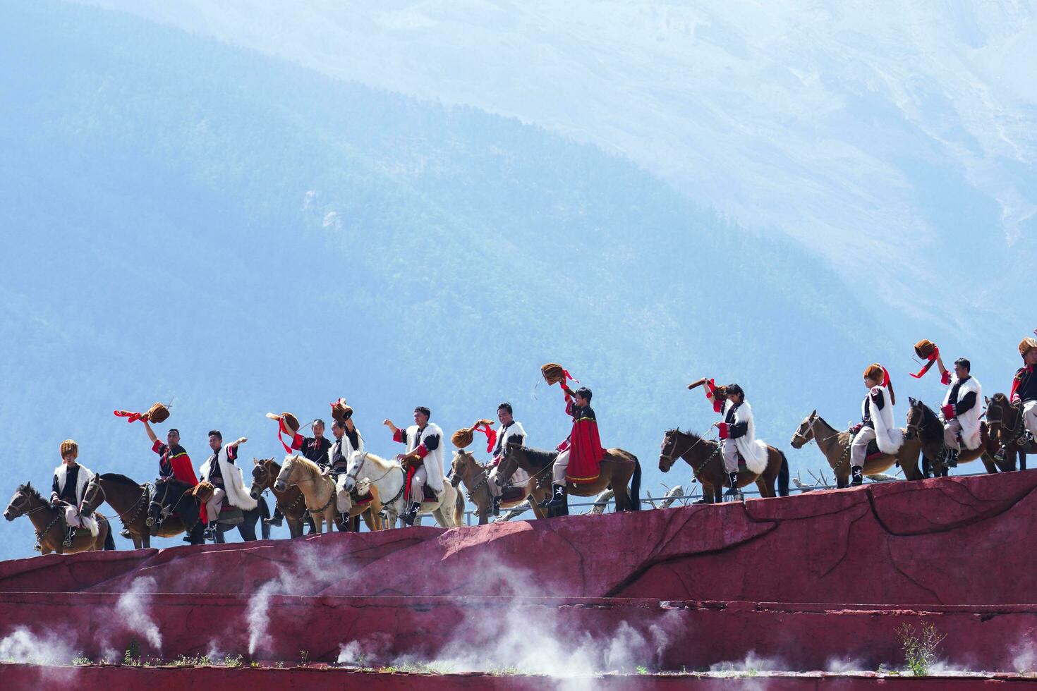 Lijiang ,China- SEP 04,2023 -Impression Lijiang is a grand traditional show located in the Jade Dragon Snow Mountain scenic area, Lijiang, Yunnan, China. photo