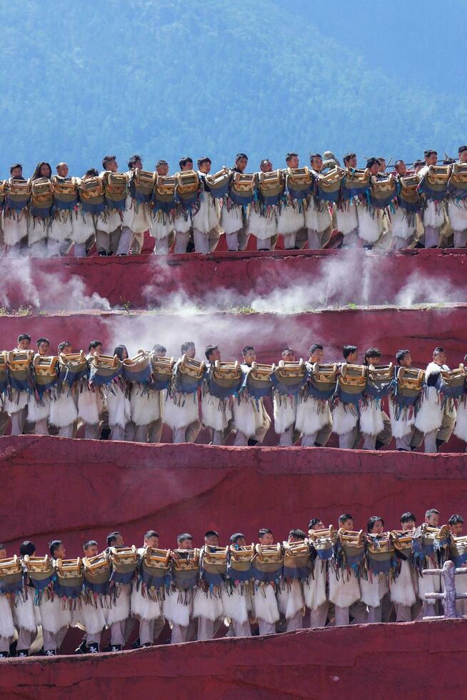 Lijiang ,China- SEP 04,2023 -Impression Lijiang is a grand traditional show located in the Jade Dragon Snow Mountain scenic area, Lijiang, Yunnan, China. photo