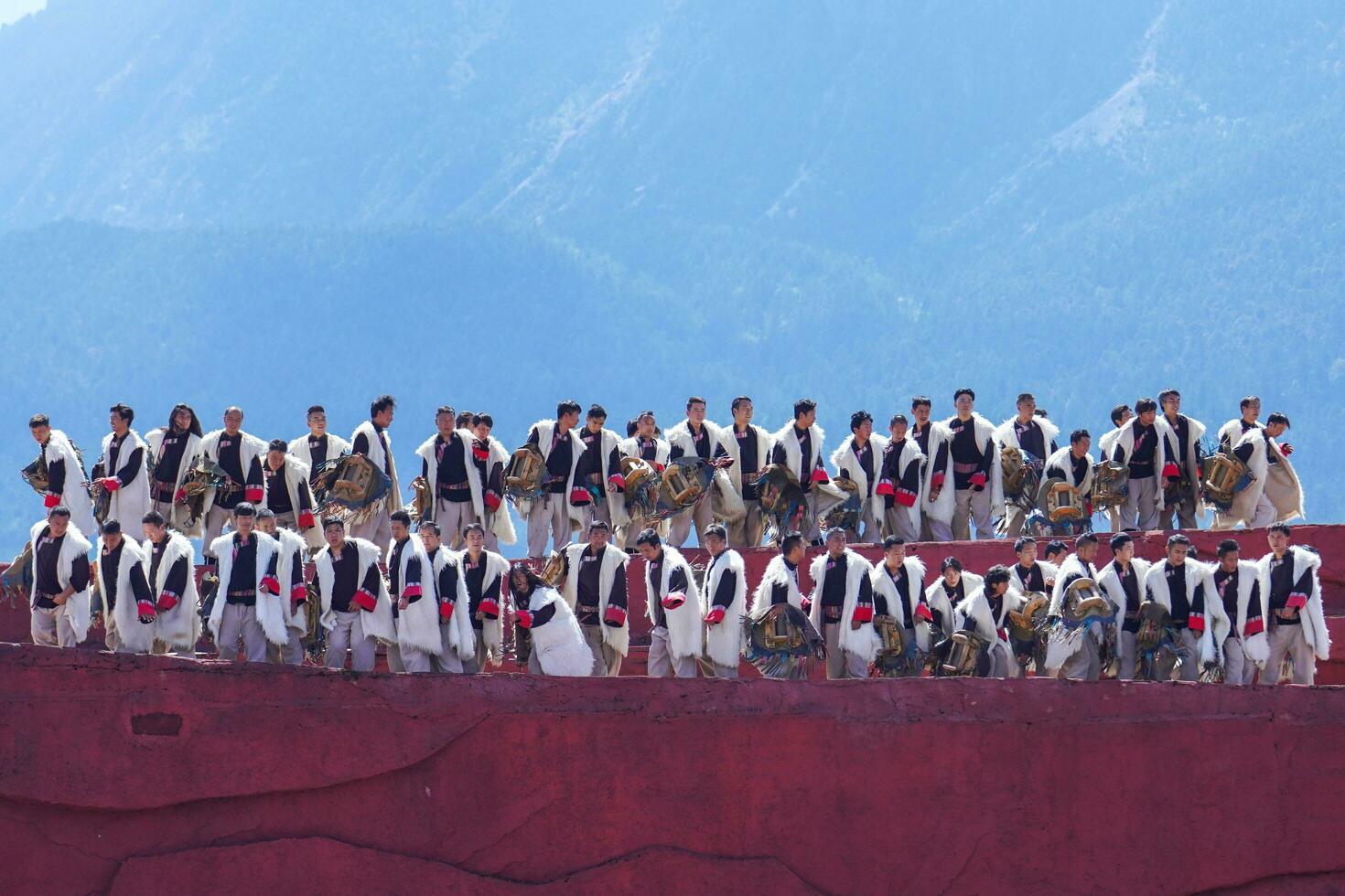 Lijiang ,China- SEP 04,2023 -Impression Lijiang is a grand traditional show located in the Jade Dragon Snow Mountain scenic area, Lijiang, Yunnan, China. photo