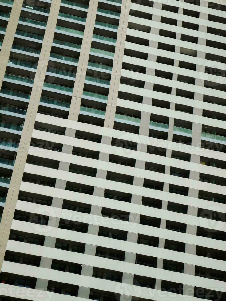 Modern skyscraper mirrored facade background. photo