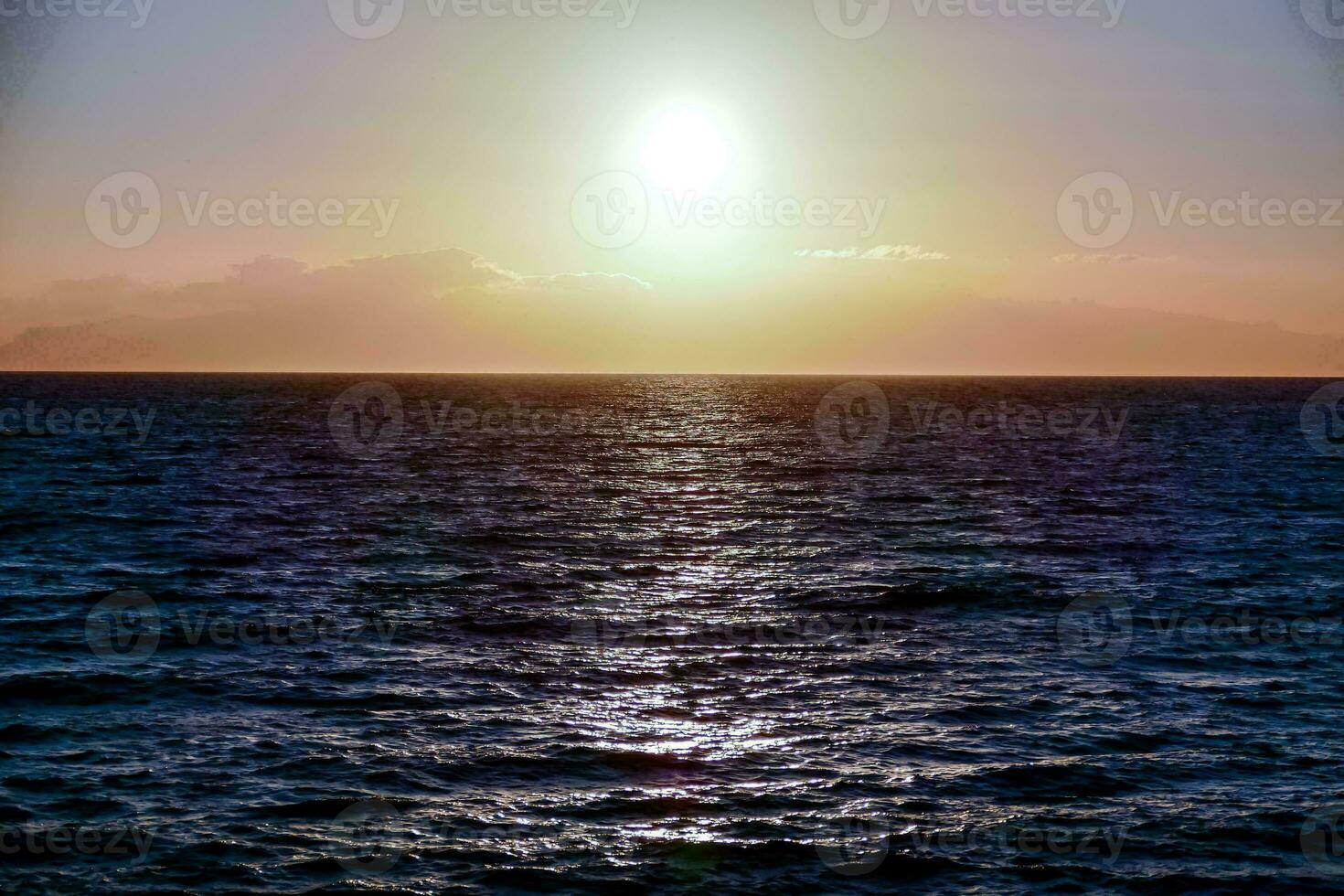 A beautiful sunset over the water photo