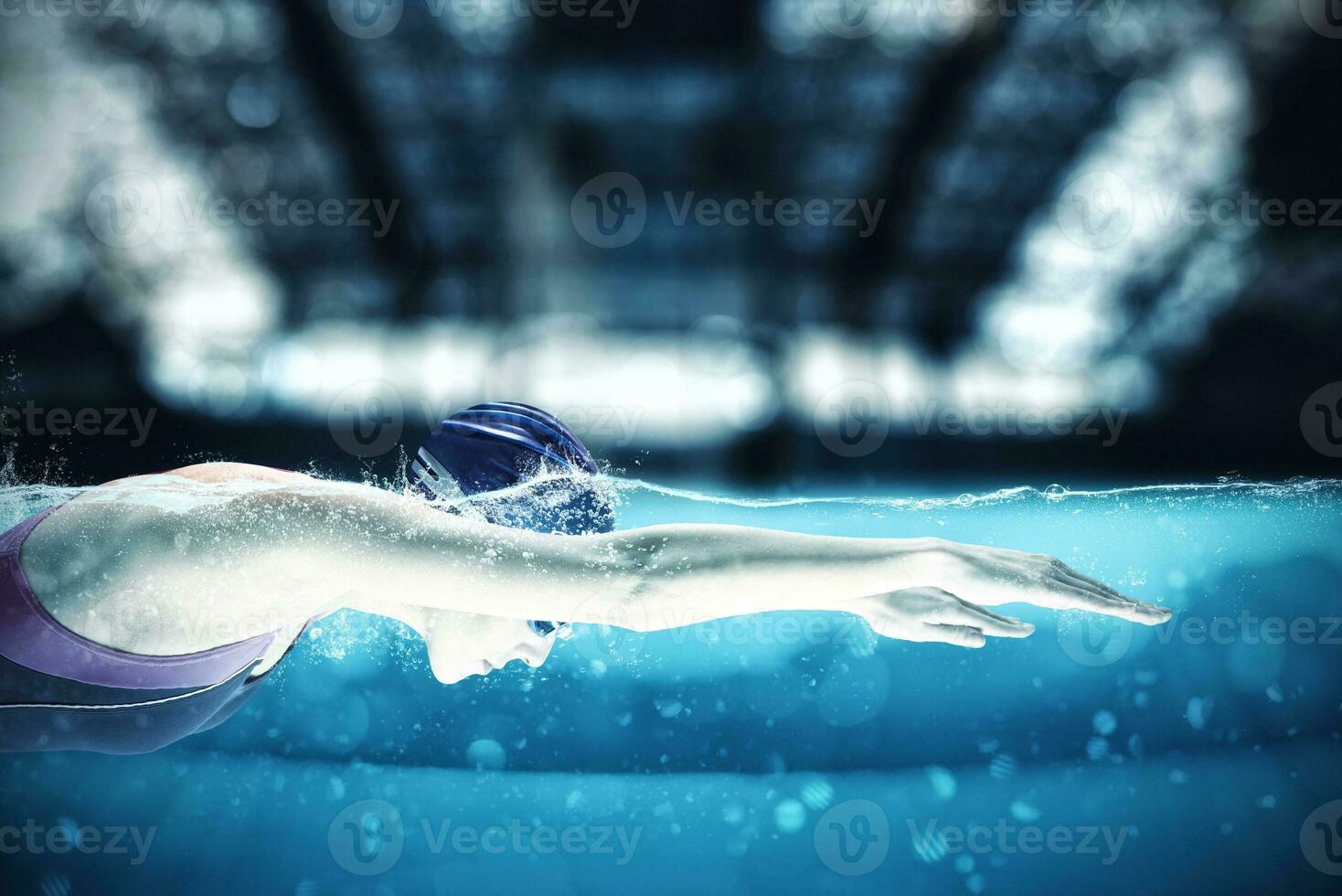 Sporty athlete swims with energy during a competition in the pool photo