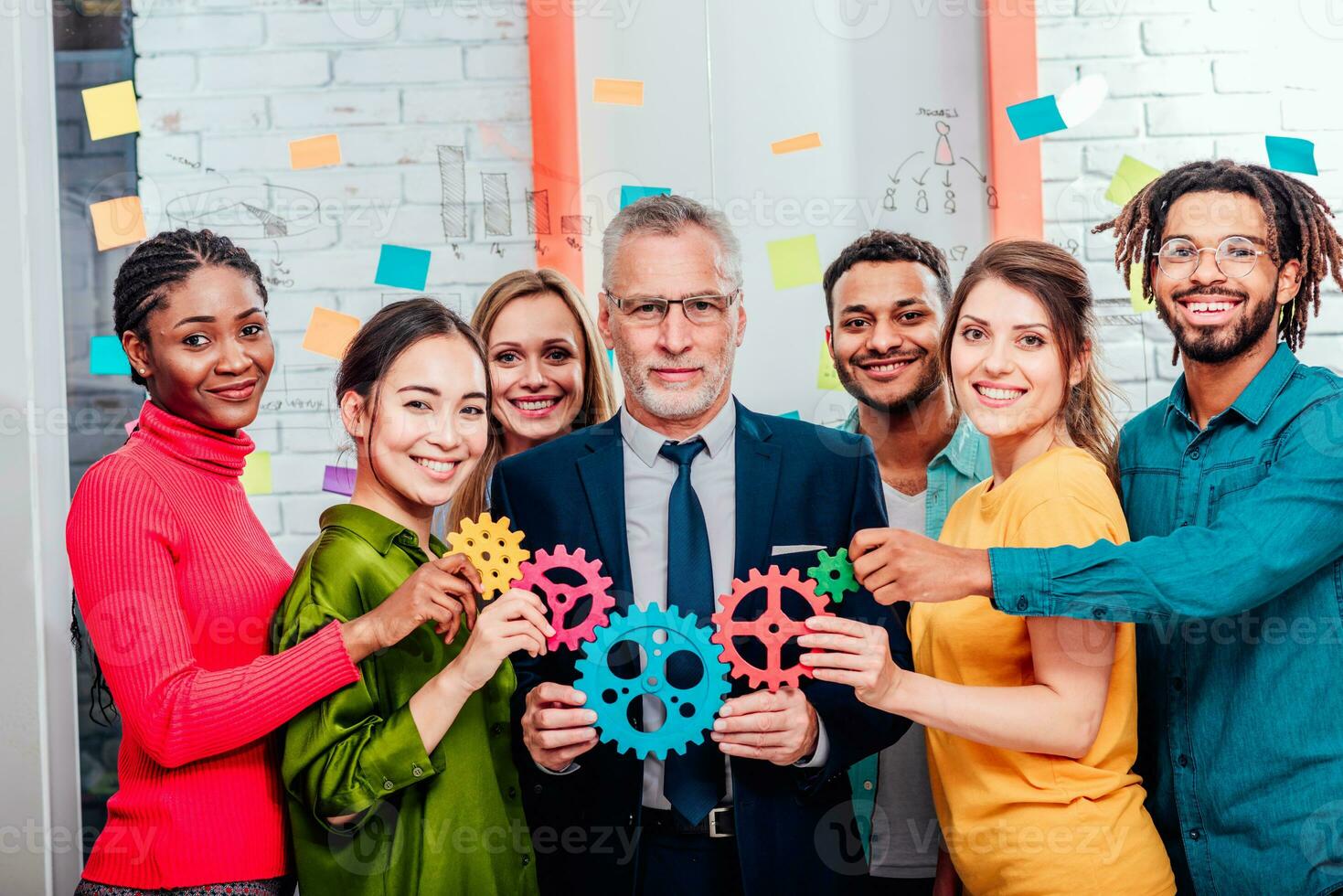 Business team connect pieces of gears like a teamwork and partners photo