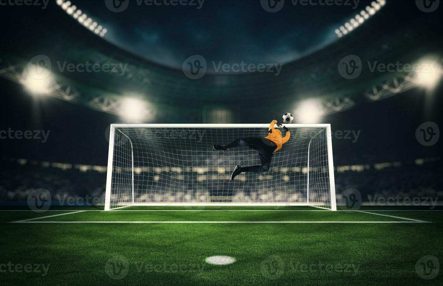 Soccer goalkeeper that makes a great save and avoids a goal during a match at the stadium photo