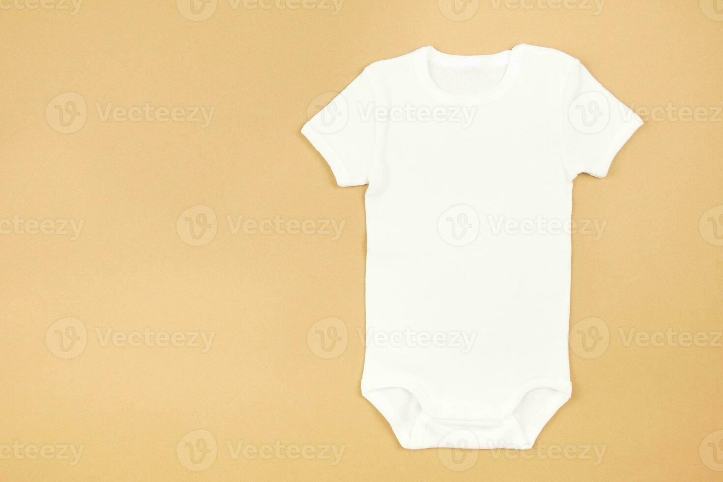 White baby girl or boy bodysuit mockup flat lay on craft paper background. Design onesie template, print presentation mock up. Top view. photo