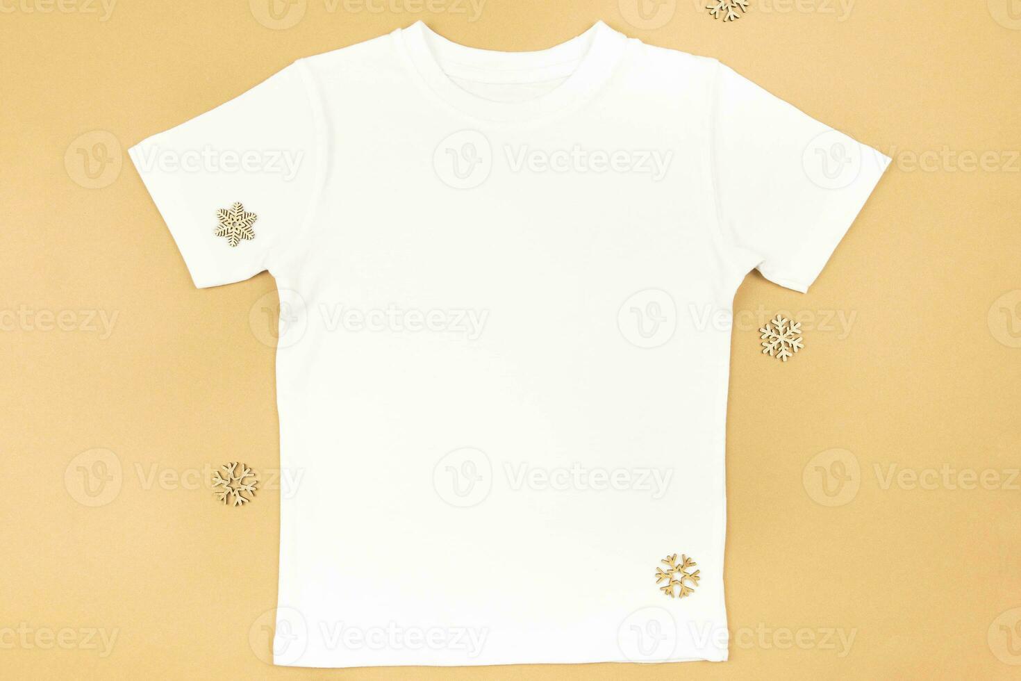 White man or women cotton t-shirt mockup with christmas decoration on craft paper background. Design t shirt template, print presentation mock up. Top view flat lay. photo