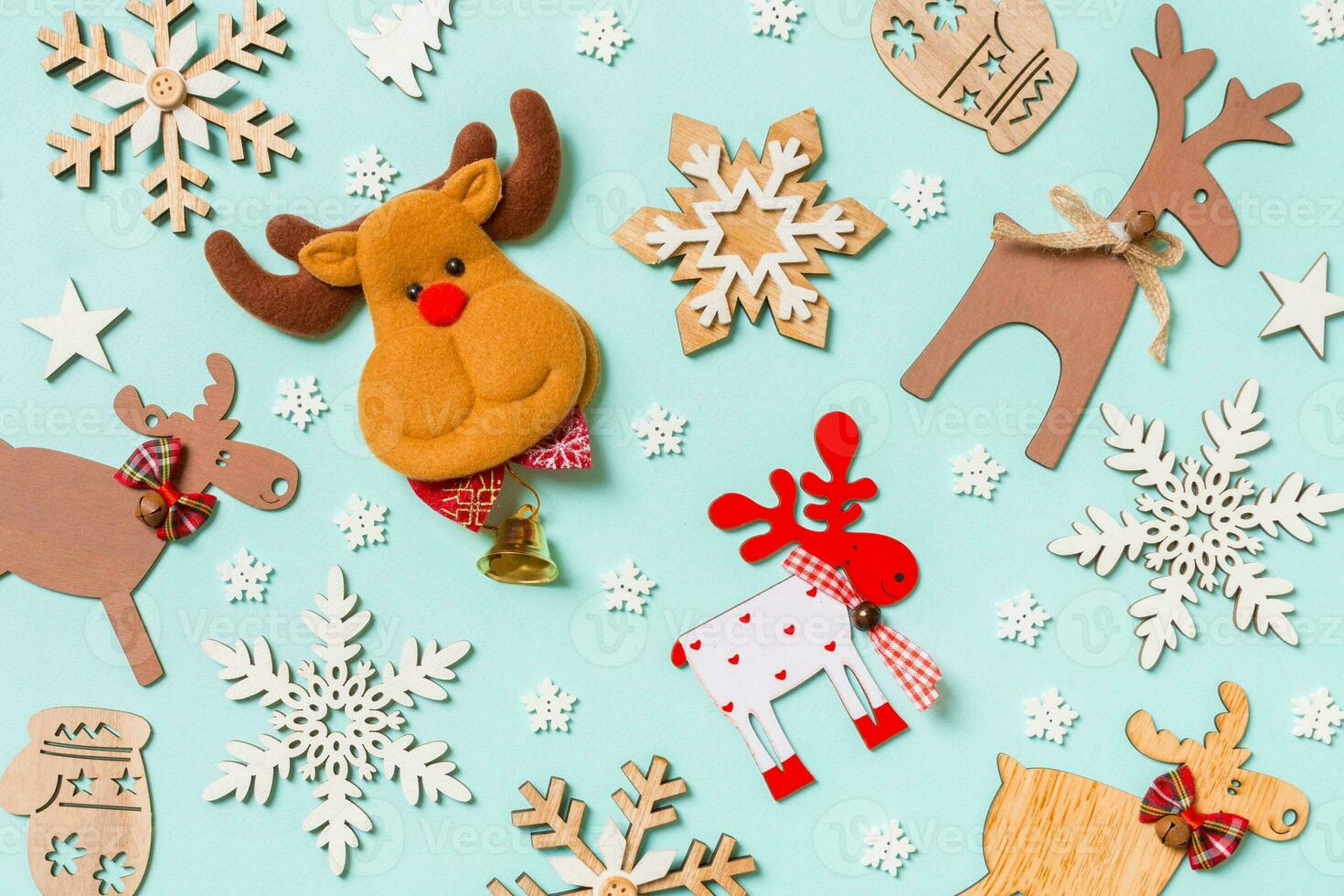 Top view of holiday decorations and toys on blue background. Christmas ornament concept photo