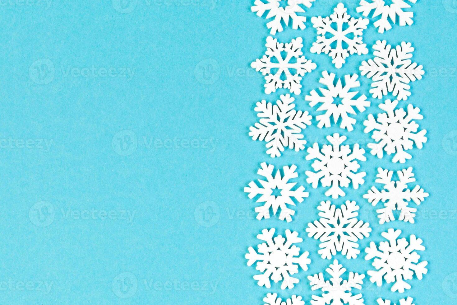 Set of white snowflakes on colorful background. Top view of Christmas ornament. New Year time concept with empty space for your design photo