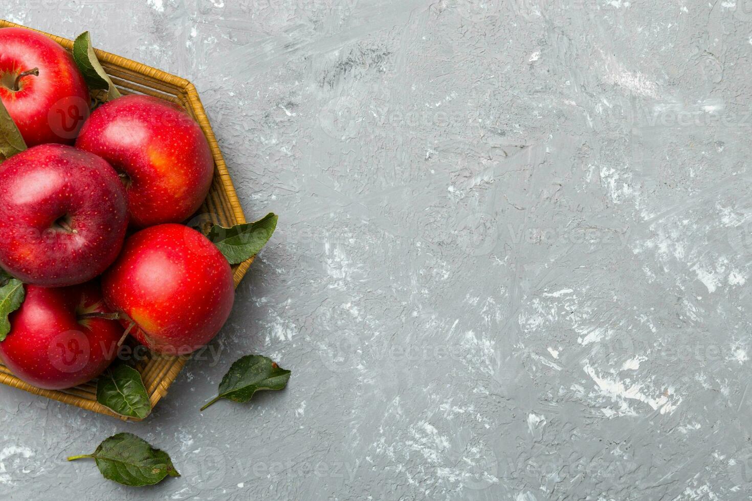 Many red apples on colored background, top view. Autumn pattern with fresh apple above view with copy space for design or text photo
