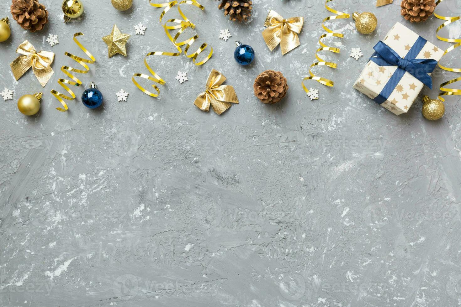 New Year composition. Christmas decor background with pine cones. Top view with copy space photo