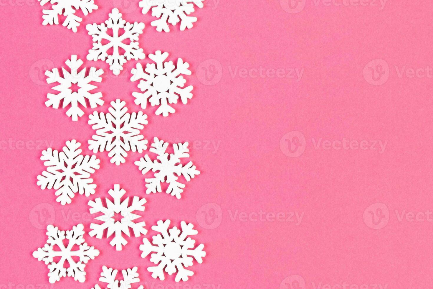 Set of white snowflakes on colorful background. Top view of Christmas ornament. New Year time concept with empty space for your design photo