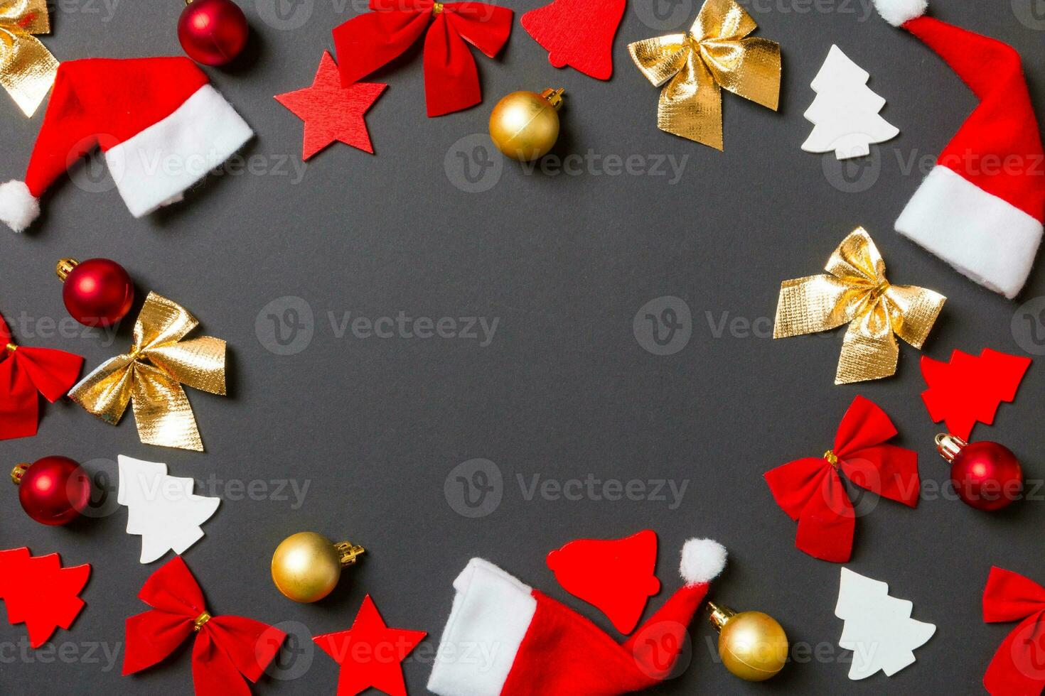 Top view of black background with New Year toys and decorations. Christmas time concept with copy space photo