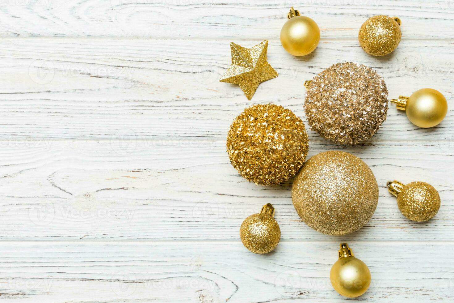 Creative set of New Year baubles and decorations on wooden background. Top view of Christmas time concept. Copy space photo