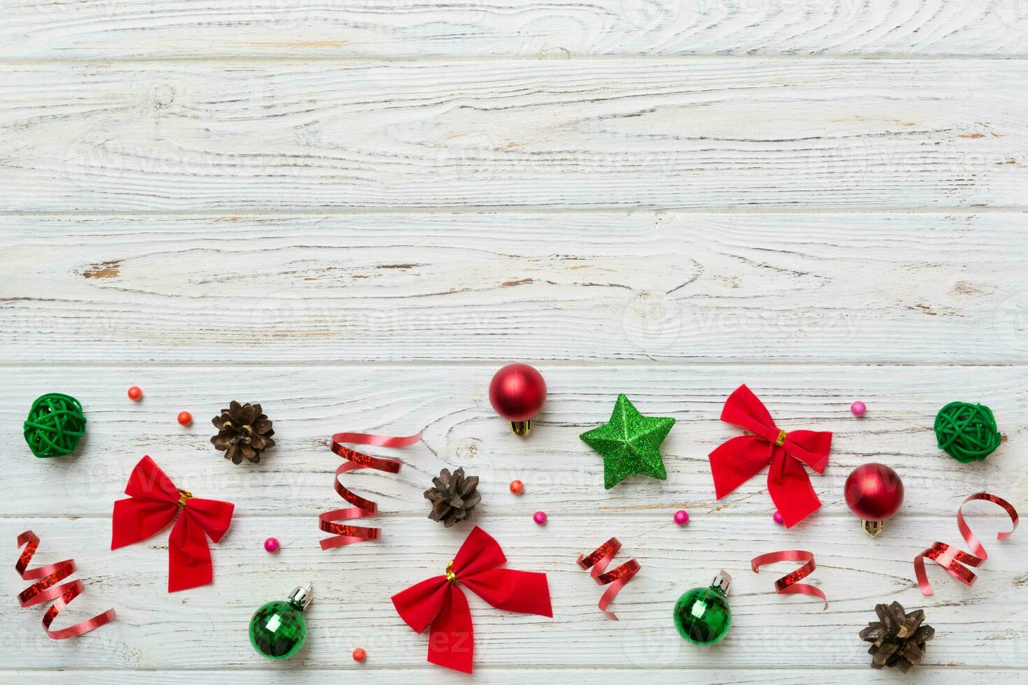New Year composition white christmas snowflakes. Christmas decor background with pine cones. Top view with copy space photo