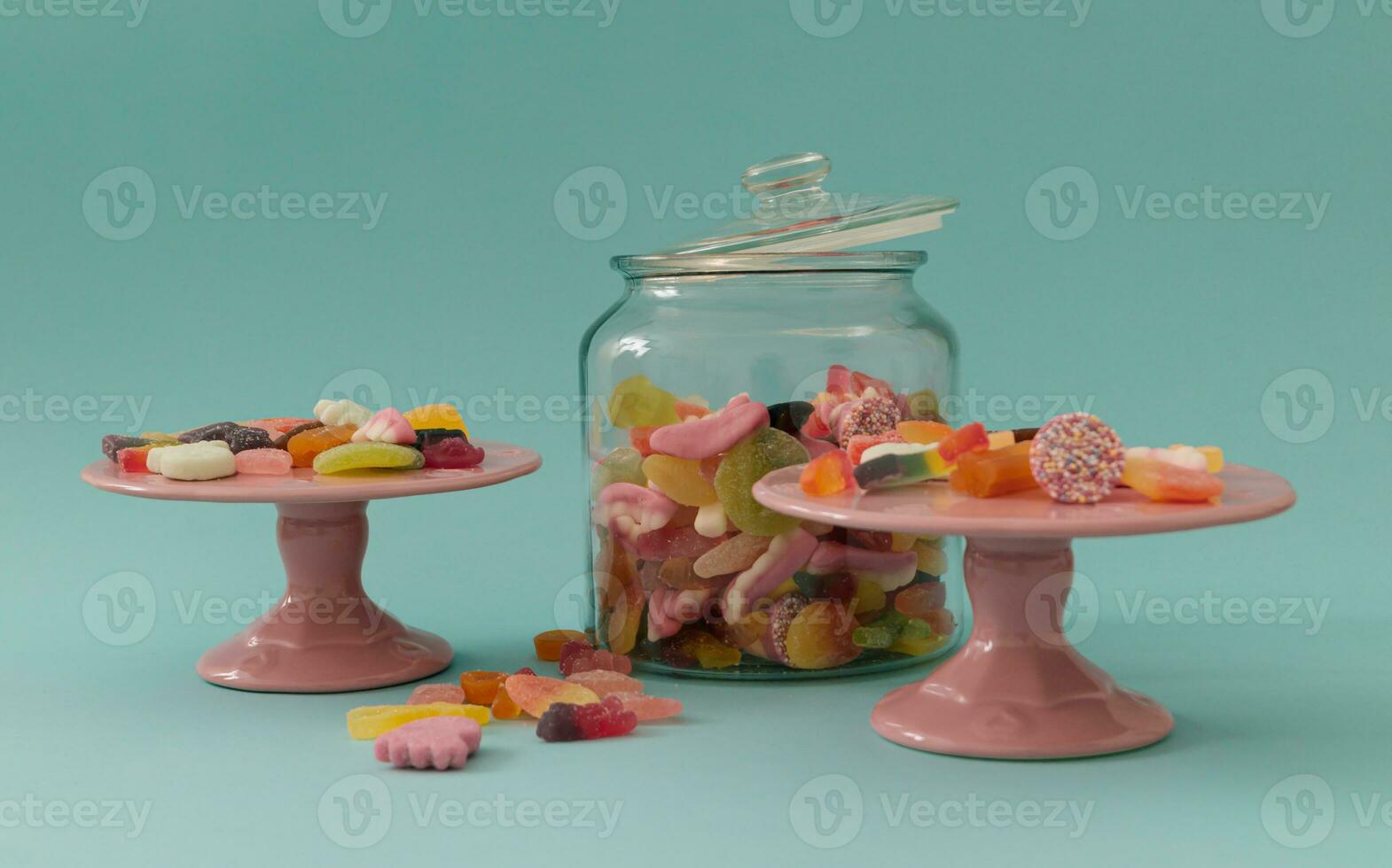 Creative layout made of colorful gummy candies on pastel blue background. Vintage decor design. Minimal concept. photo
