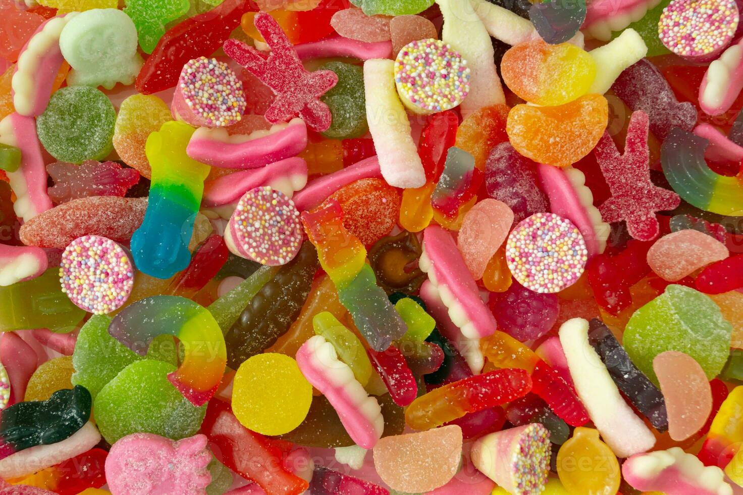 Creative background made of gummy candies. Colorful flat lay. Jelly sweets aesthetic. photo