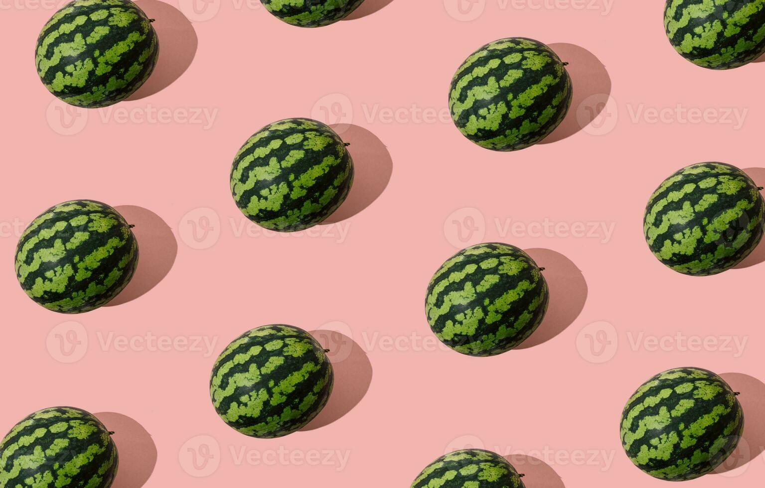 Summer fruit pattern made of green watermelon on light pastel pink background. Creative minimal fruit layout. Nature summer background concept. Watermelon aesthetic. photo