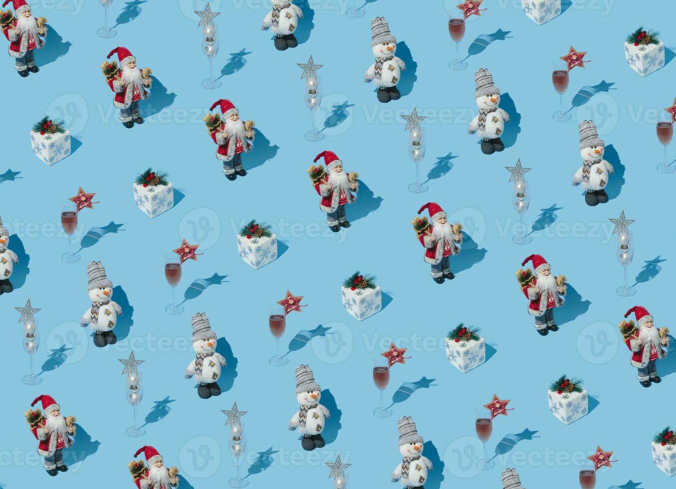 Fancy Christmas pattern made with various winter and New Year objects on bright light blue background. Minimal creative Christmas concept. Trendy holiday idea. photo