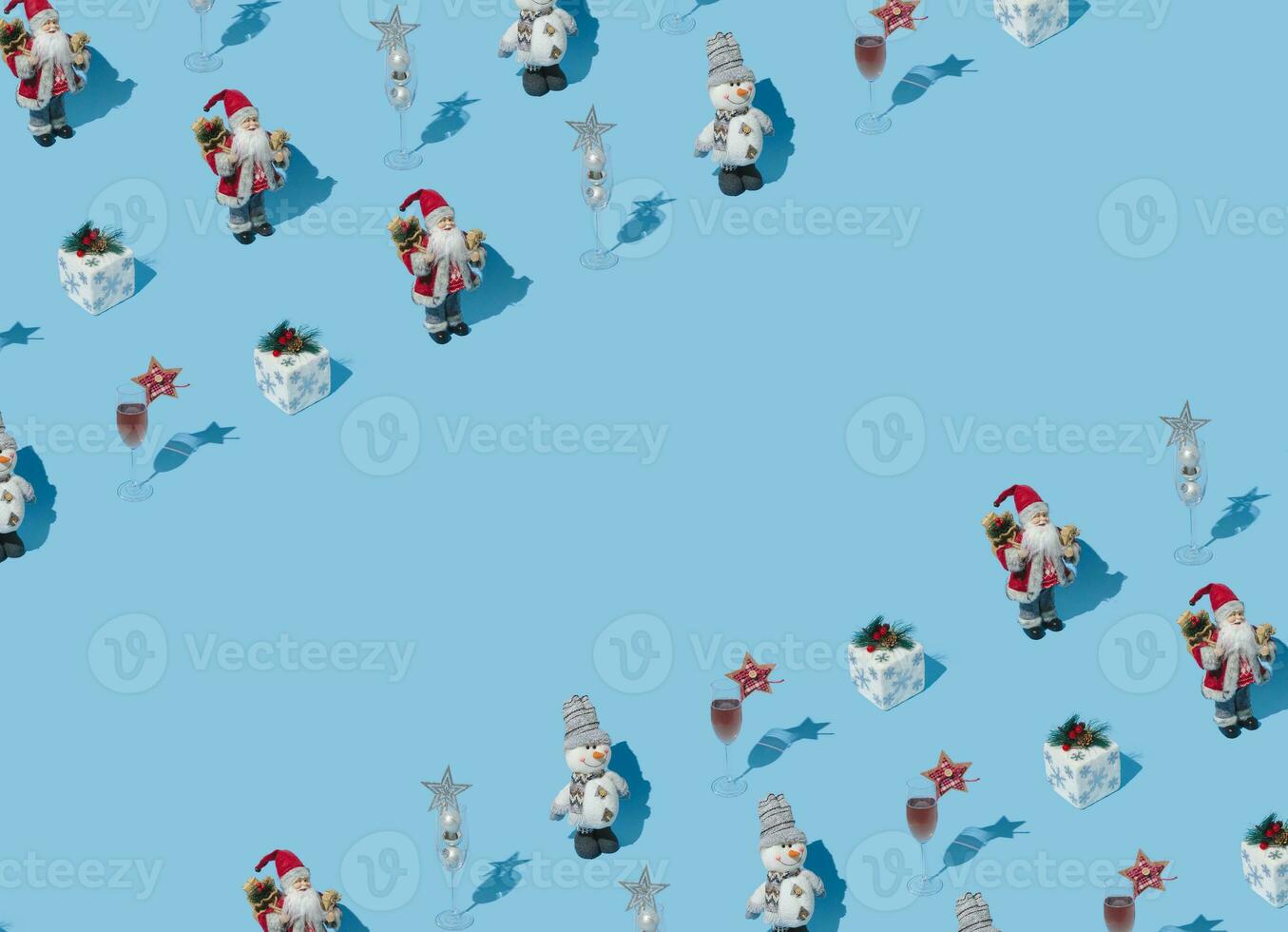 Fancy Christmas pattern made with various winter and New Year objects on bright light blue background with copy space. Minimal creative Christmas concept. Trendy holiday idea. photo