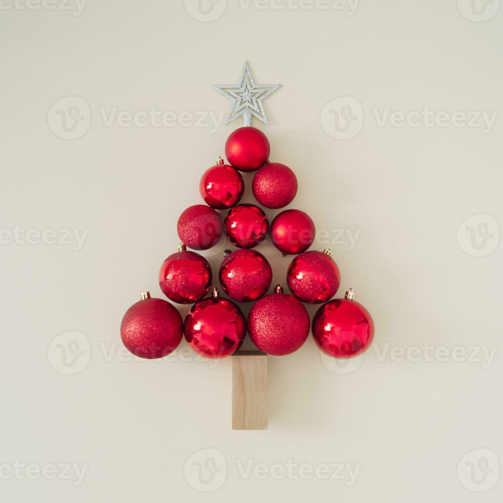 Christmas tree made of bauble decoration on pastel background. Minimal New Year concept. Creative Christmas background. Trendy Holiday composition. Flat lay, top of view. photo