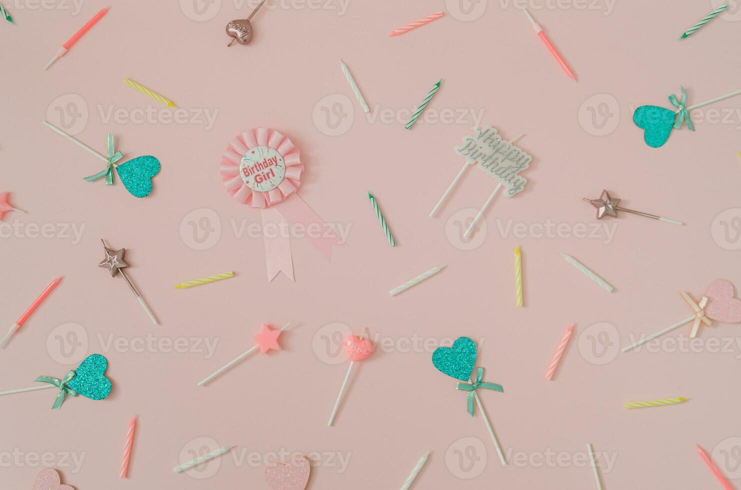 Beautiful pattern made of birthday party things on light pink background. Creative birthday girl concept. Minimal birthday party idea. Trendy flat lay pattern composition. Top of view. photo
