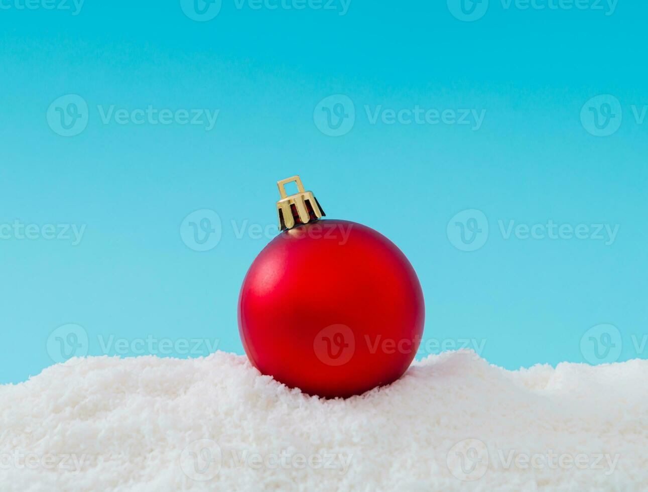 Creative composition made of Christmas bauble decoration on snow. Minimal holiday background. Fancy Christmas or New Year concept. Trendy winter holiday idea. Christmas aesthetic. photo