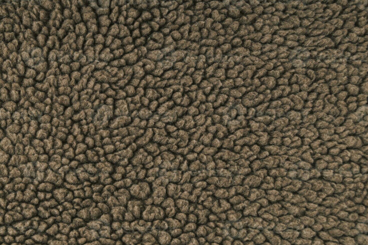Trendy brown fur backdrop. Minimal background and texture concept. Flat lay cosy fur background idea. Copy space. photo