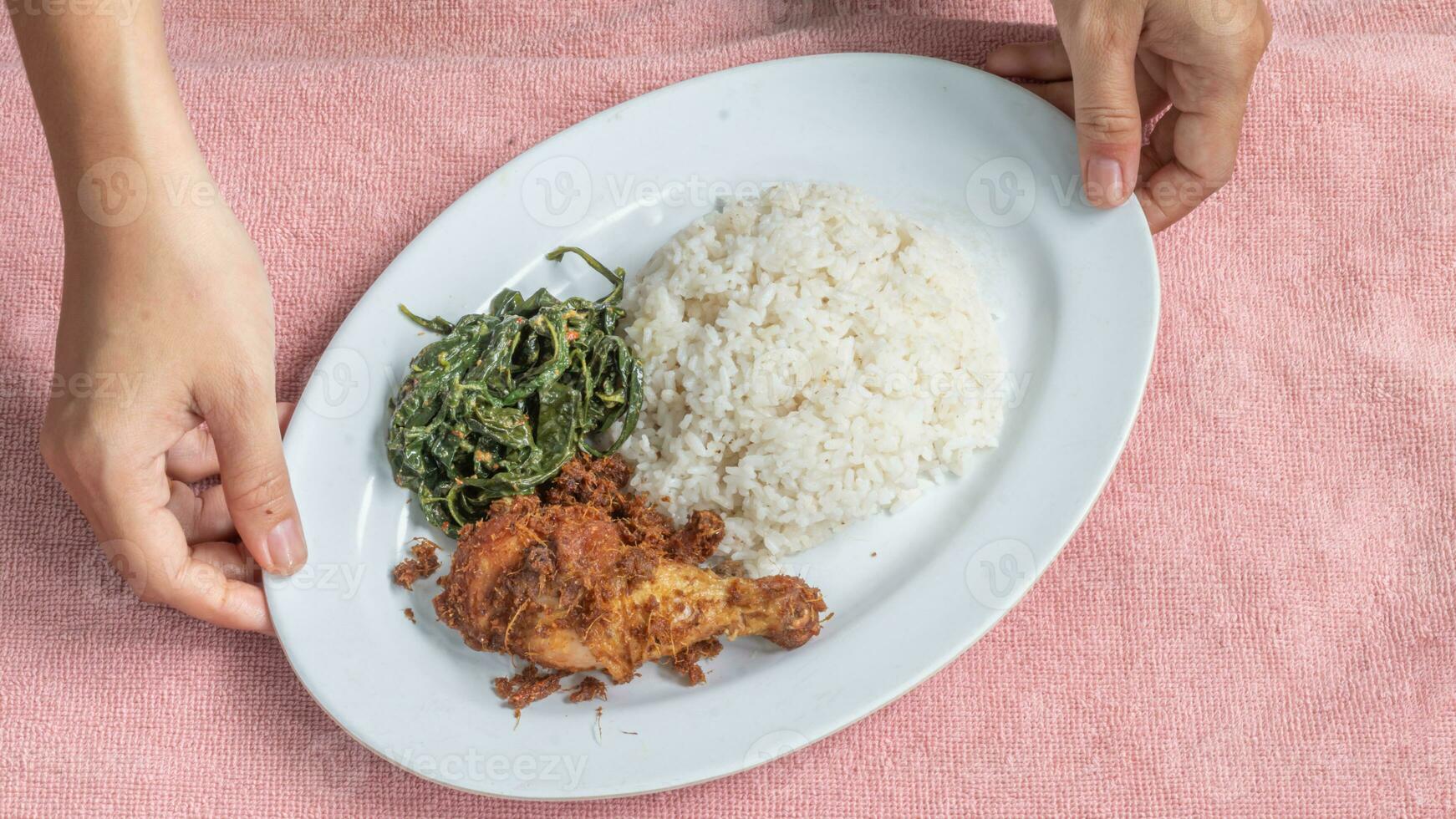 Ayam goreng Kalasan and Gulai daun ubi, Indonesian traditional cuisine made from fried chicken photo