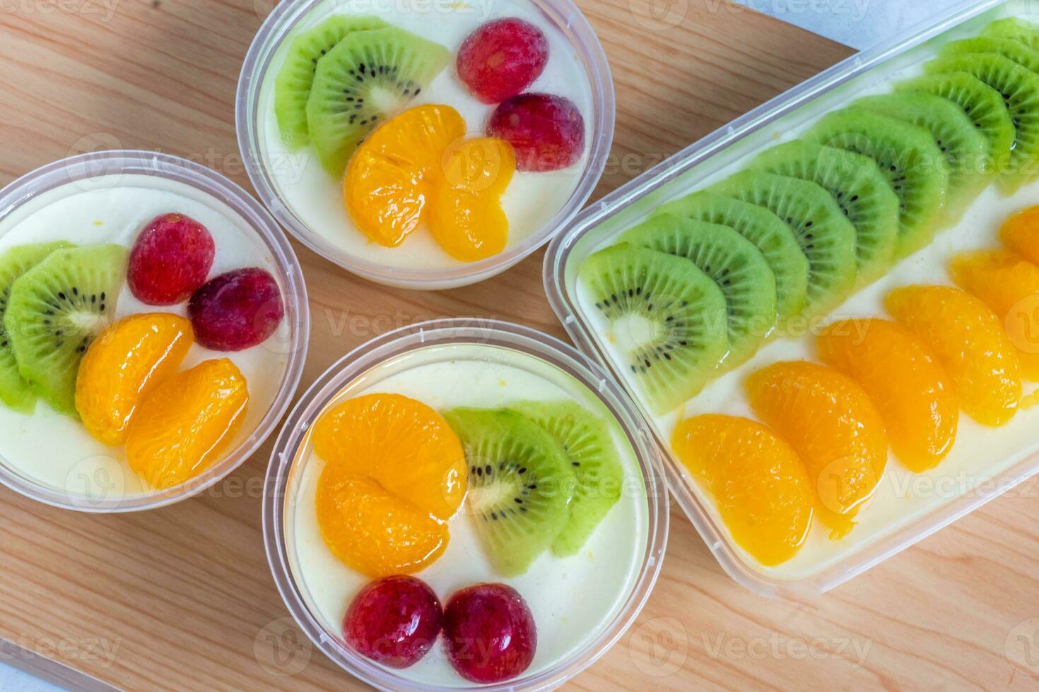 Fruity milk pudding, sweet chocolate silk pudding dessert with fruit topping photo