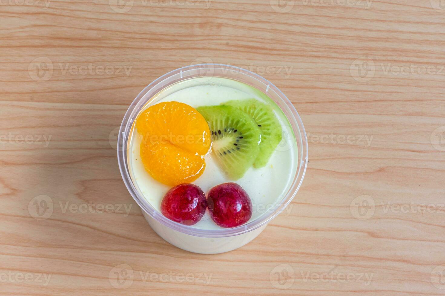 Fruity milk pudding, sweet chocolate silk pudding dessert with fruit topping photo
