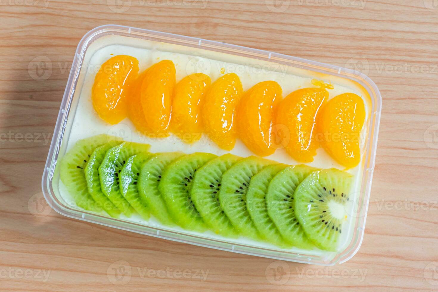 Fruity milk pudding, sweet chocolate silk pudding dessert with fruit topping photo