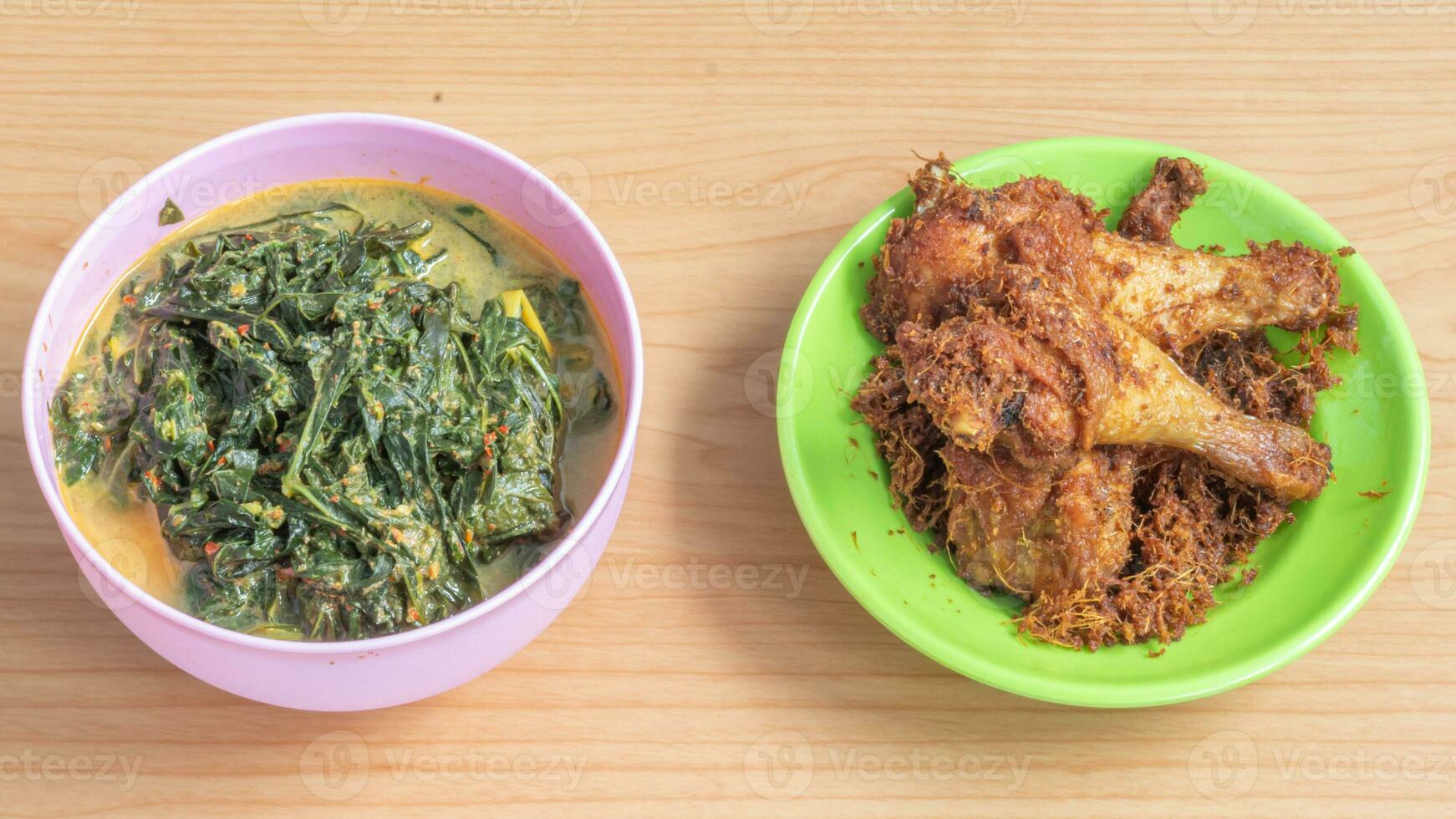 Ayam goreng Kalasan and Gulai daun ubi, Indonesian traditional cuisine made from fried chicken photo