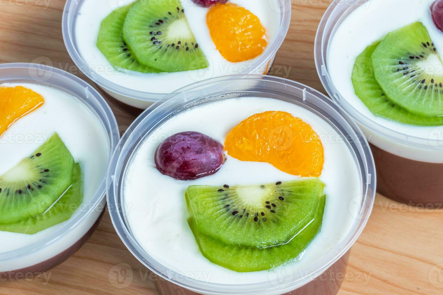 Fruity milk pudding, sweet chocolate silk pudding dessert with fruit topping photo