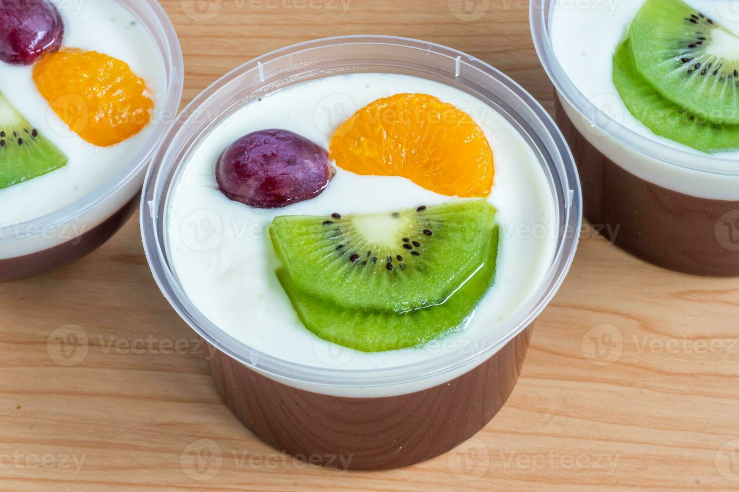 Fruity milk pudding, sweet chocolate silk pudding dessert with fruit topping photo