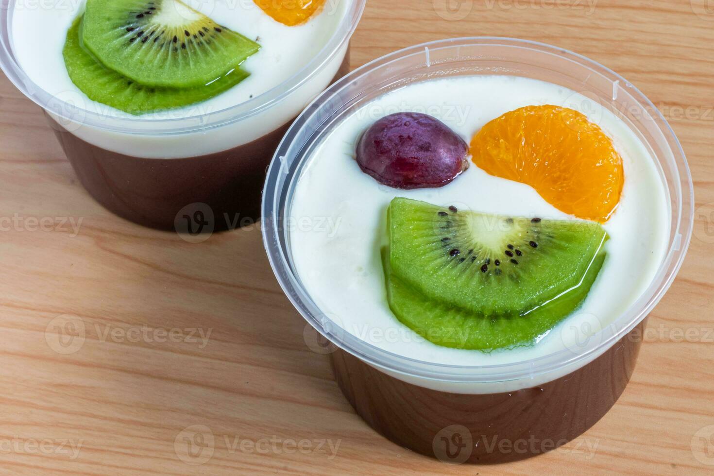 Fruity milk pudding, sweet chocolate silk pudding dessert with fruit topping photo