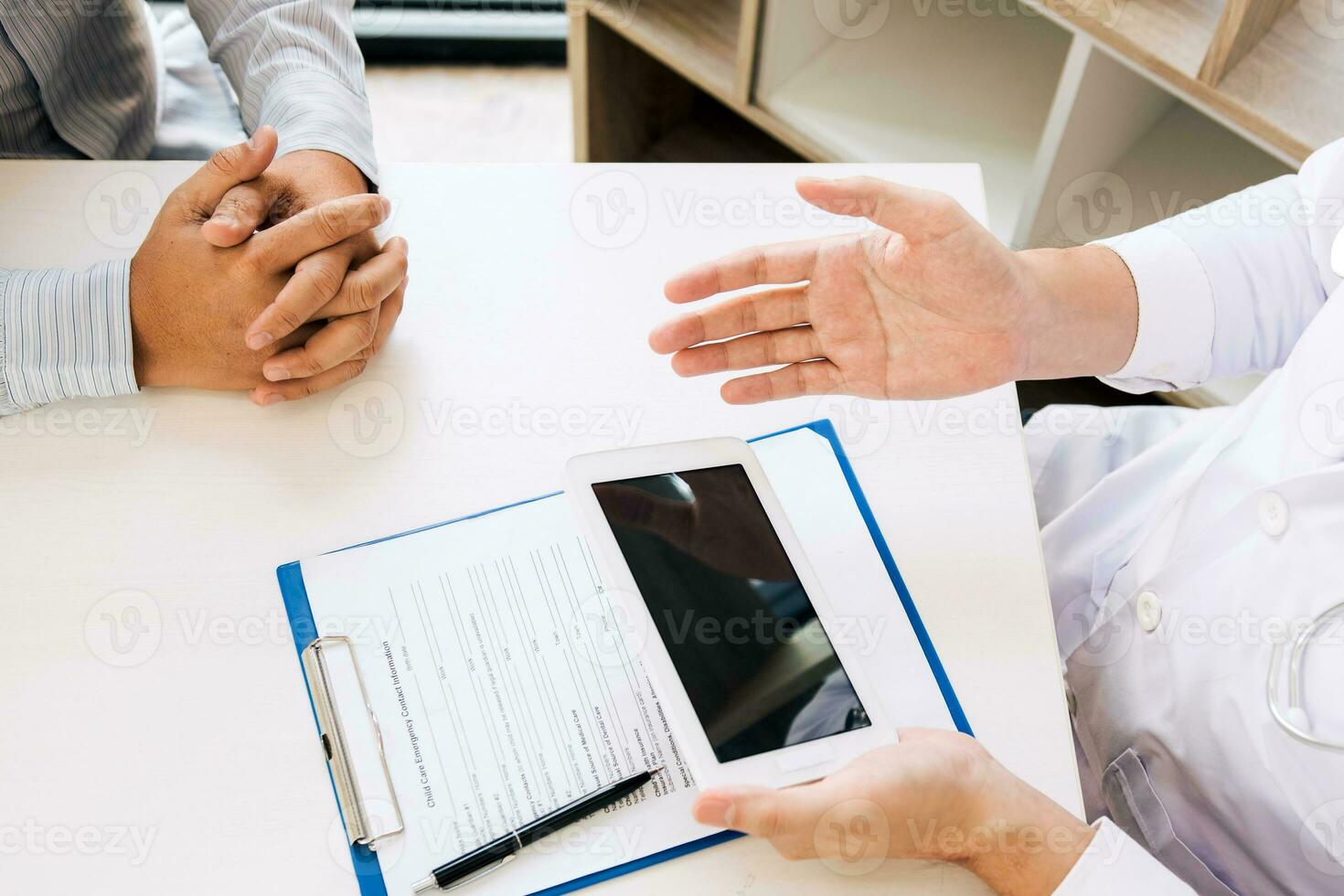 Doctor is explaining the properties of the drug to the patient as well as providing the accompanying documentation. photo