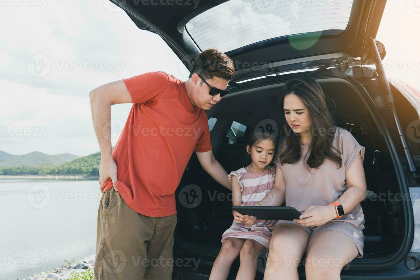 Summer vacations.Happy family enjoying trip with their favorite car. Holiday and travel family concept. photo