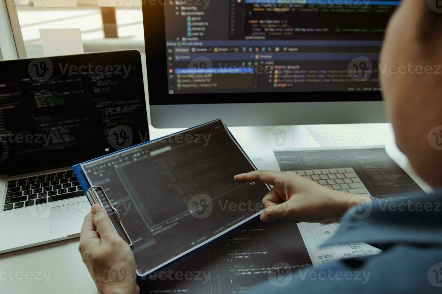 Asian man working code program developer computer web development working design software on desk in office. photo