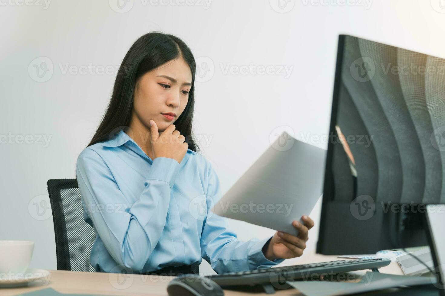 Stress asian woman while coding data programmer on desktop PC while working on computer codes in the office. photo