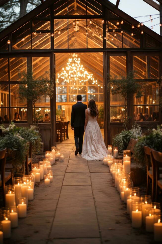 Rustic barn venue adorned with string lights and greenery photo