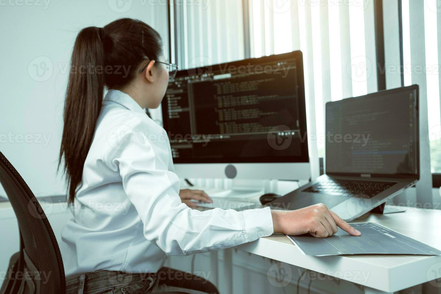 Developing programming and coding technology working in a software engineers developing applications in office. photo