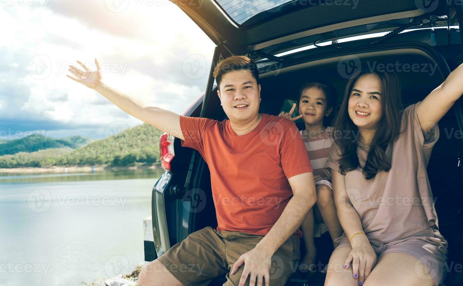 Summer vacations.Happy family enjoying trip with their favorite car. Holiday and travel family concept. photo