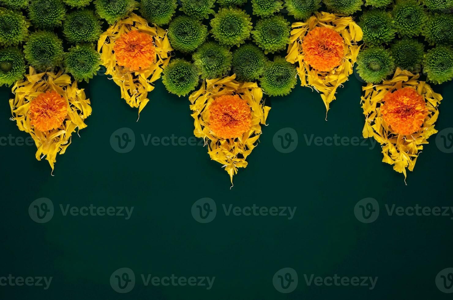 Colorful flowers and petals set as flame shape to celebrate for Diwali festival on dark green background. photo