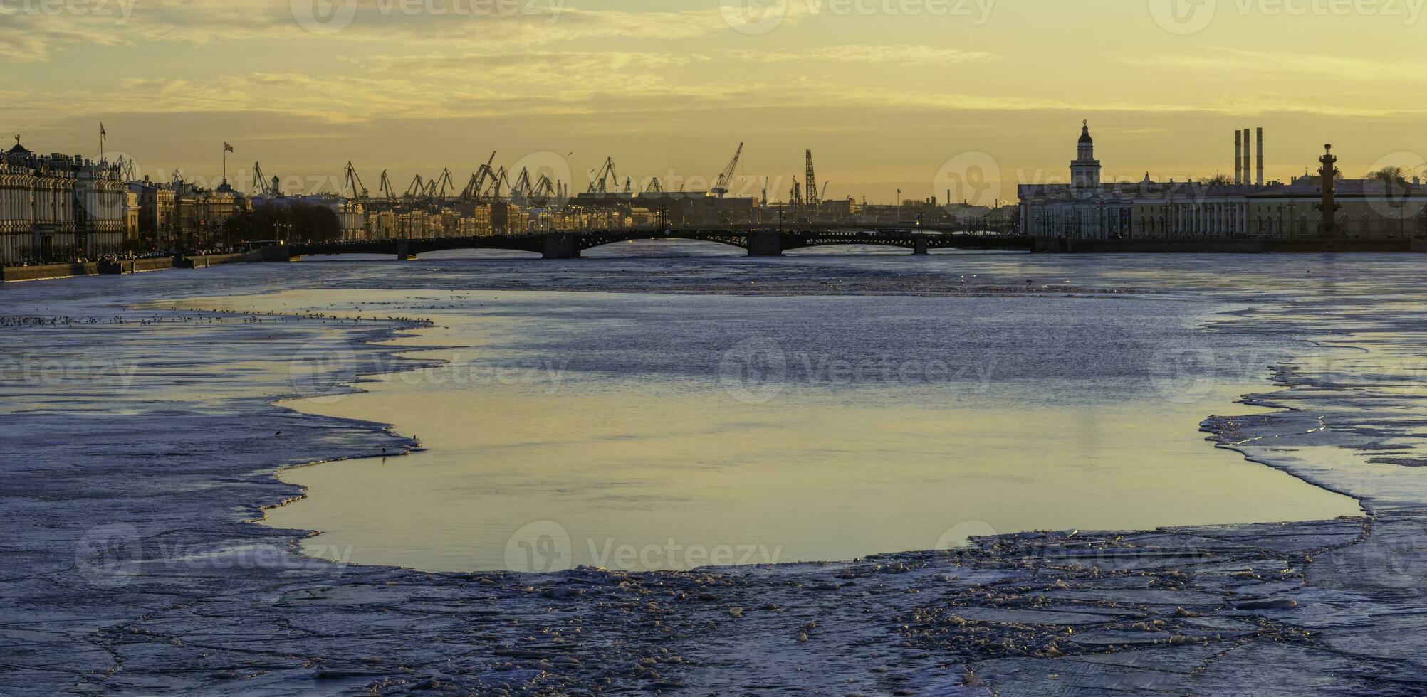 Spring evening St. Petersburg. Ice melts on the Neva River. Suns photo