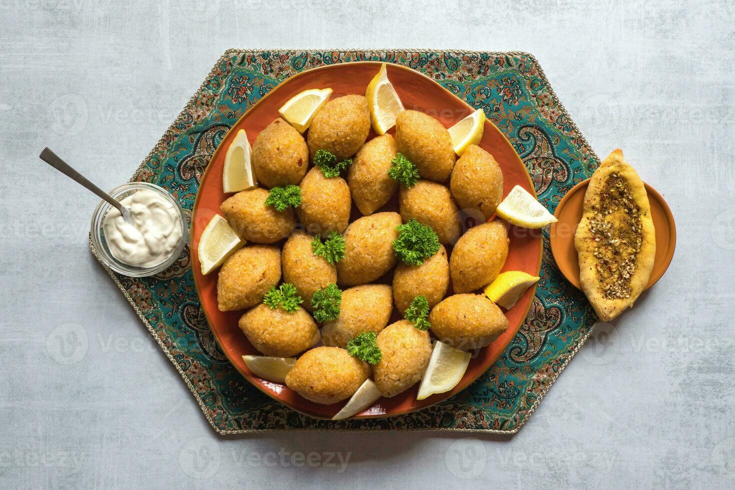 Arabic meat appetizer Kibbeh. Traditional Arabic kibbeh with lamb and pine nuts. photo