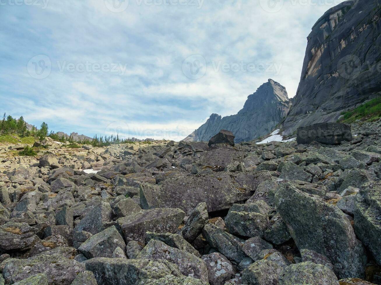 Landscape photography of stone river. Kurumnik, a large scattering of stones, granite boulders. Western Sayans mountain range. photo