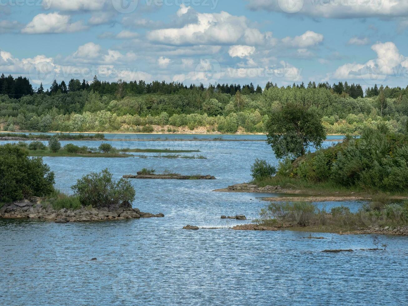 Big water lagoon. Island in the middle of the river With trees covered. An old quarry flooded with water. photo