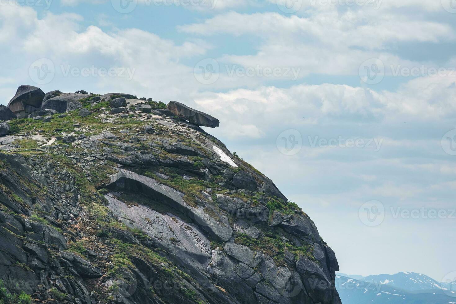 Falling large boulder on the edge of the abyss. Midday view, Western Sayan. Natural Park Ergaki. Krasnoyarsk region. Russia. photo