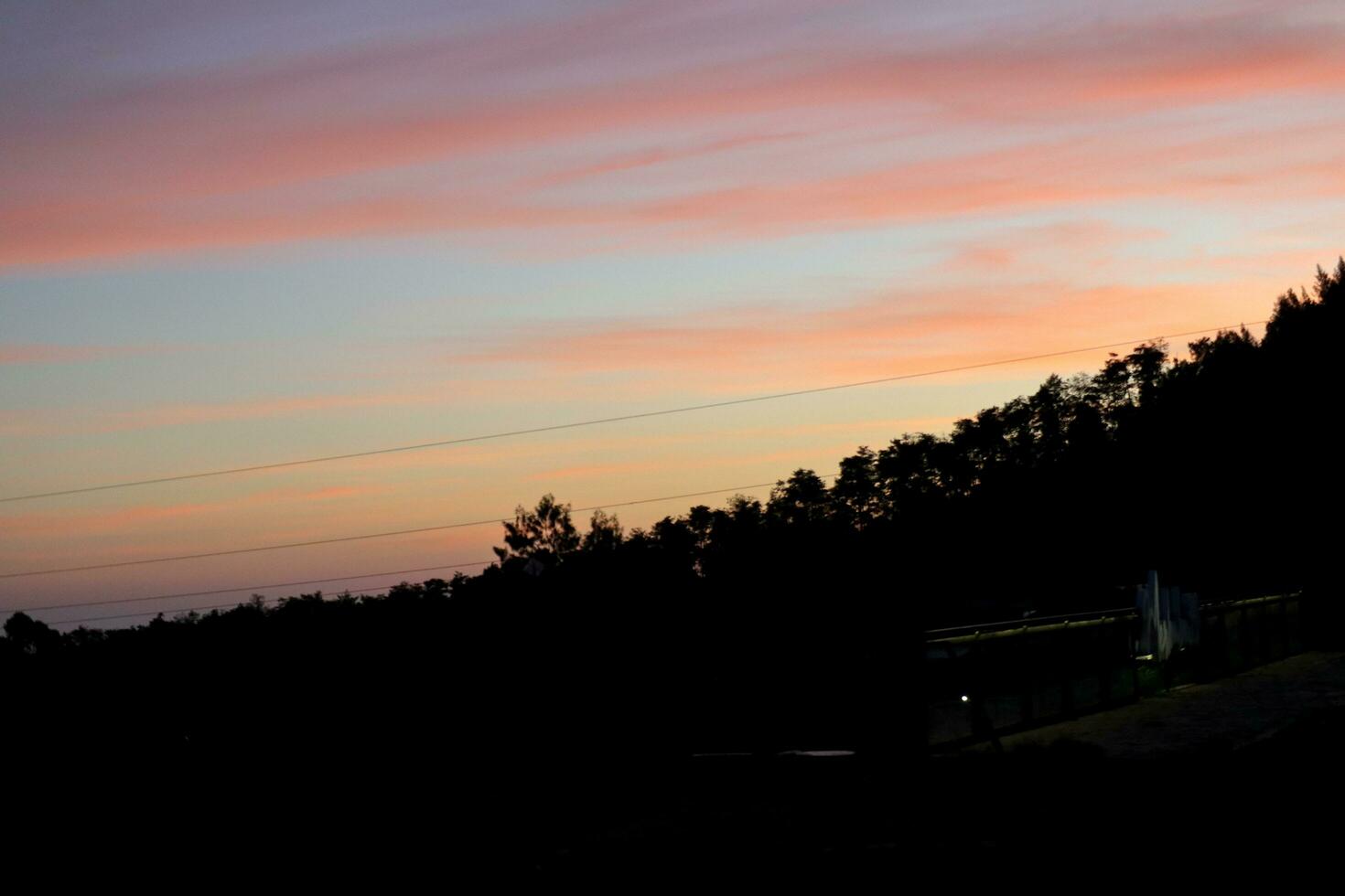 Hillside view with backlight sunset photo