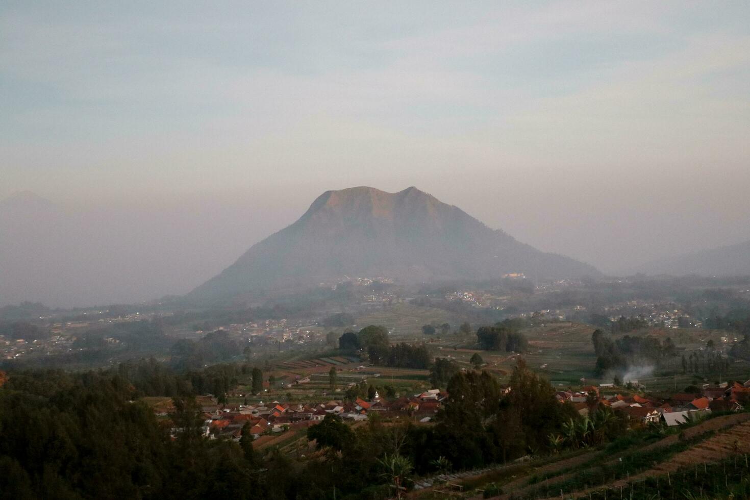 view of the mountain peak at sunrise in the morning photo